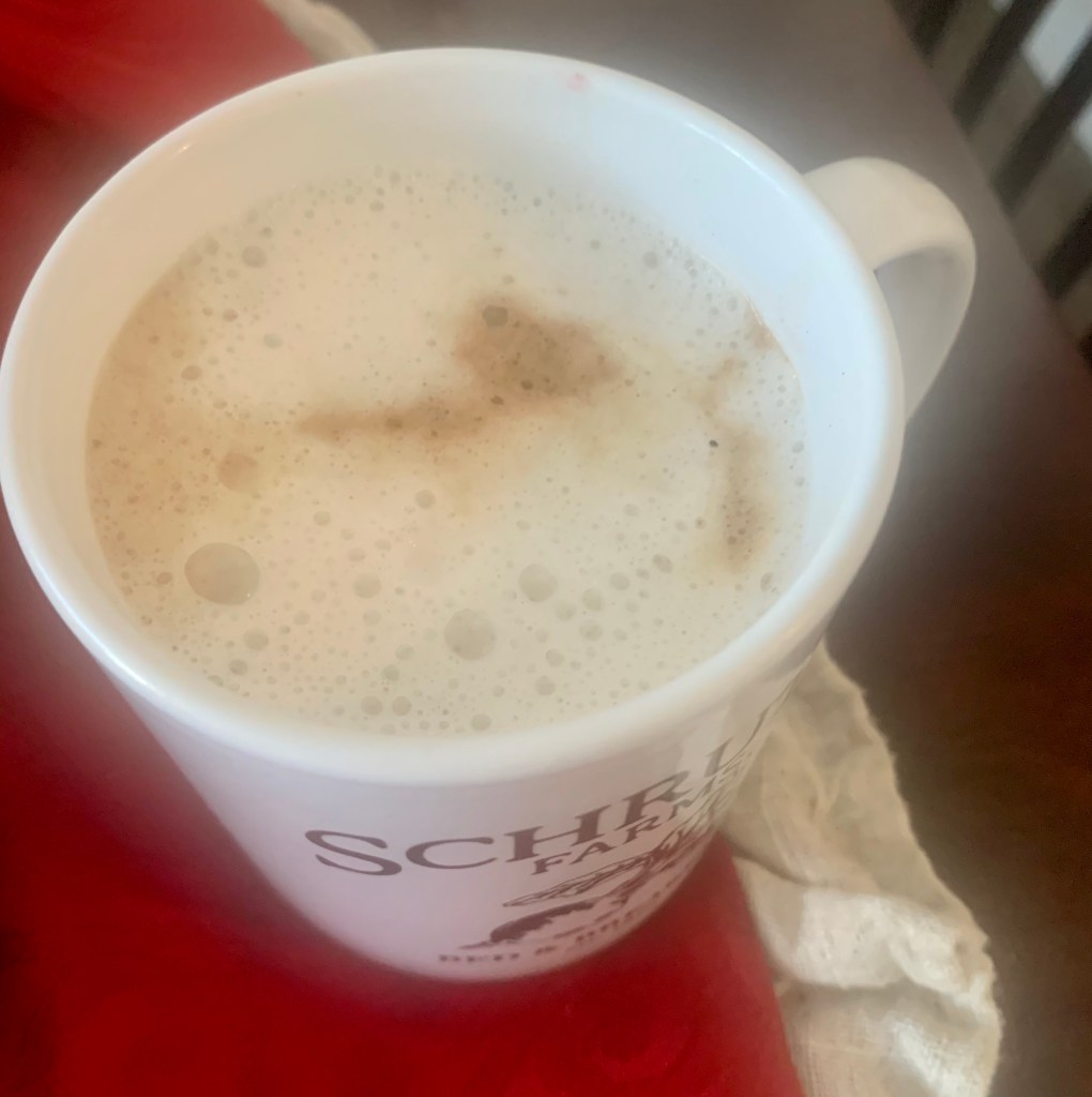 Coffee cup with frothy coffee