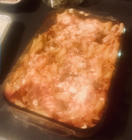 Cooked dairy free baked ziti in a glass pan